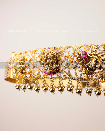 Close-up of nakshi detailing and CZ stone embellishments on traditional kemp temple vadanam