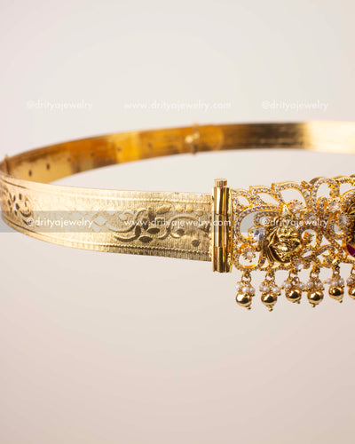 Temple waist belt featuring Goddess Lakshmi Devi motif with kemp stones, CZ work, and bead hangings