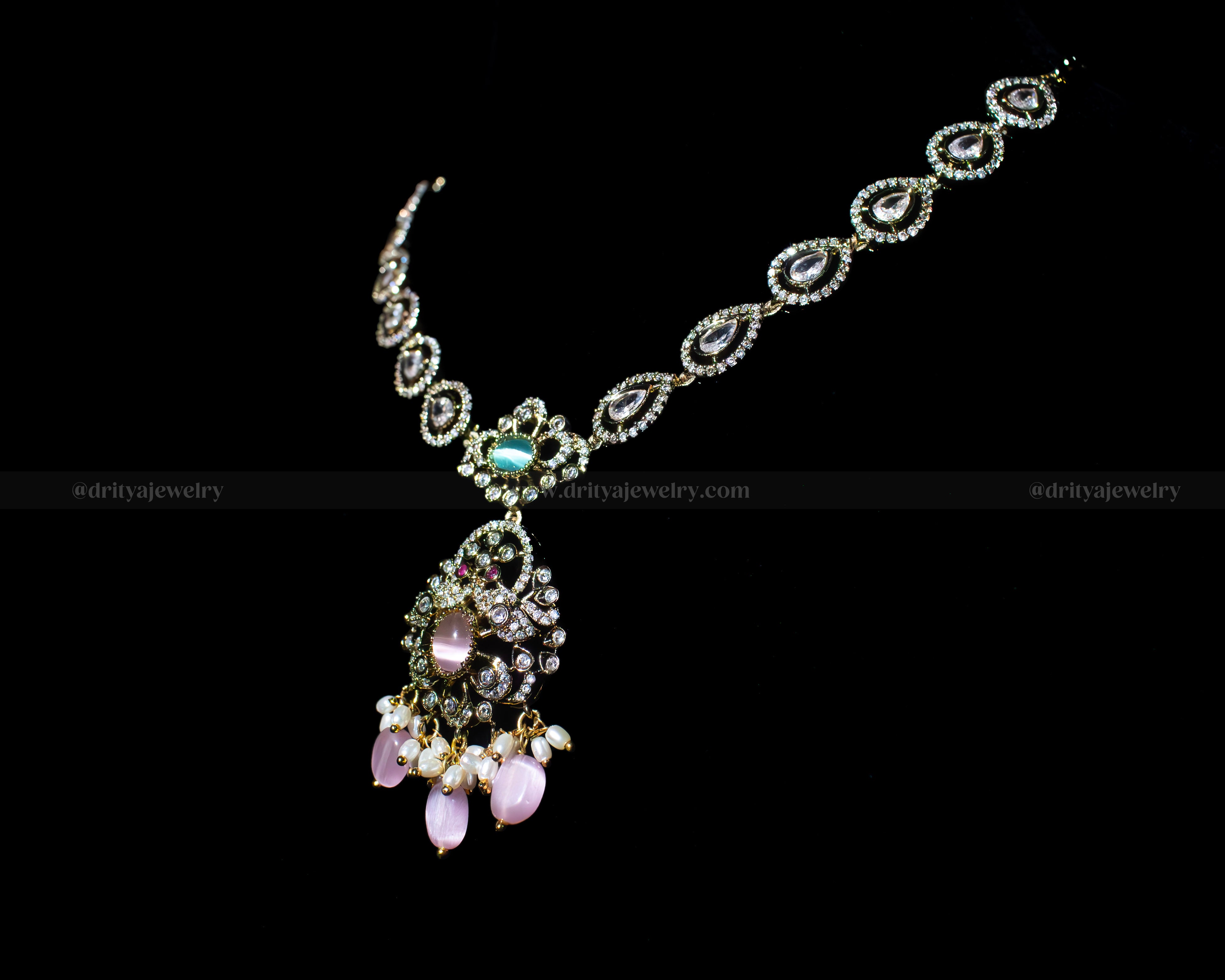 Side angle of the Dritya Victorian Mehndi Necklace highlighting its delicate chain design and pastel gemstone pendant.