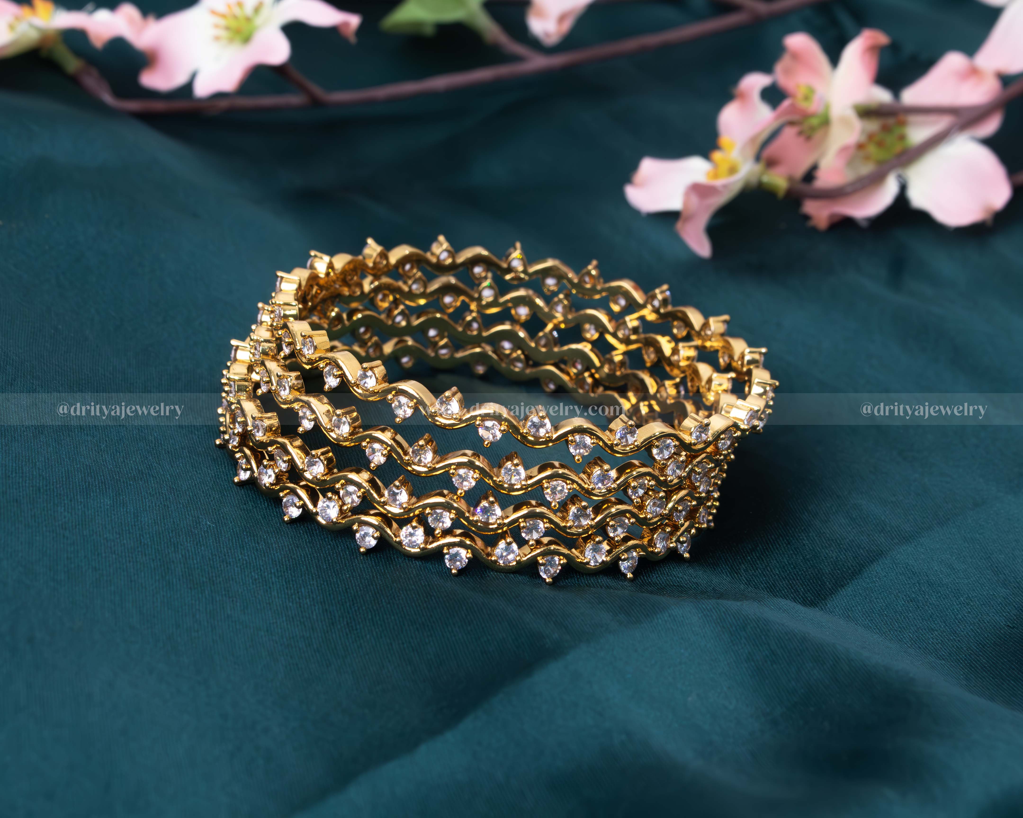 Full view of the Solitaire Diamond Look-Alike Bangle Set with shimmering CZ stones set in a gold-plated alloy by Dritya Jewelry.