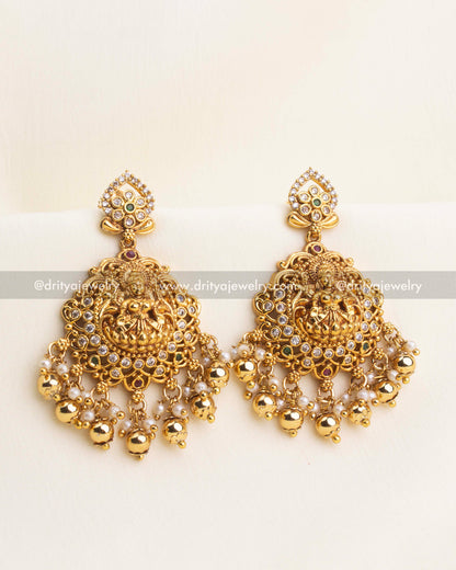 Traditional temple-style Dangler earrings with Lakshmi motif, pearls, and antique gold finish.