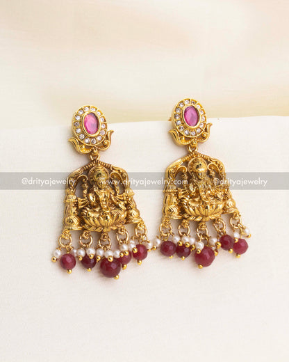 Matching ruby bead earrings with Lakshmi carvings and CZ detailing.