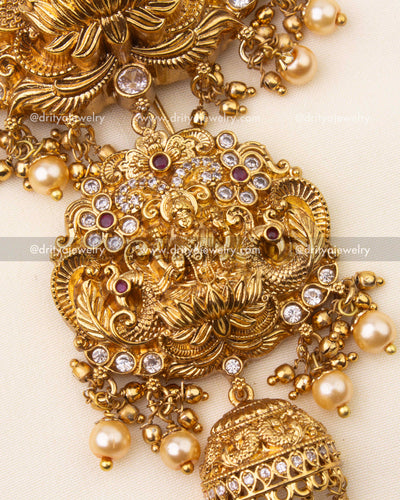Temple-inspired hair accessory with secure hook for easy wear, embellished with pearls.