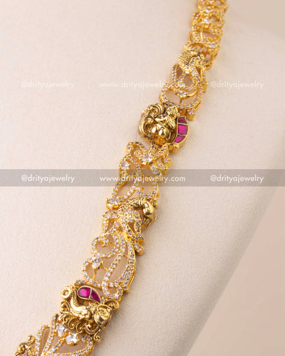 Close-up of Kemp temple necklace with elephant and peacock Nakshi motifs, embellished with CZ stones.