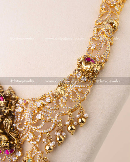 Close-up of Kemp temple necklace with elephant and peacock Nakshi motifs, embellished with CZ stones.