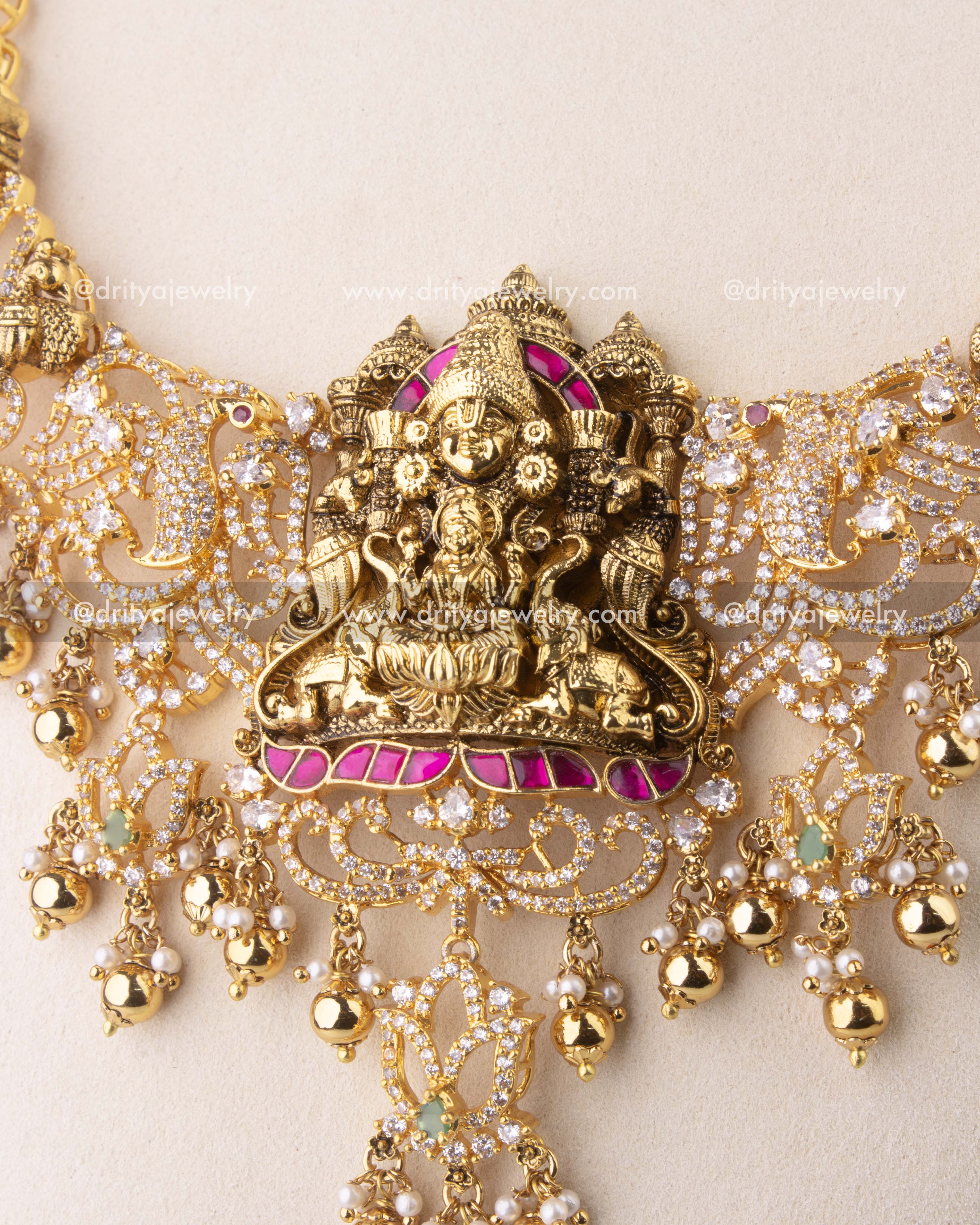Close-up of Kemp temple necklace with elephant and peacock Nakshi motifs, embellished with CZ stones.