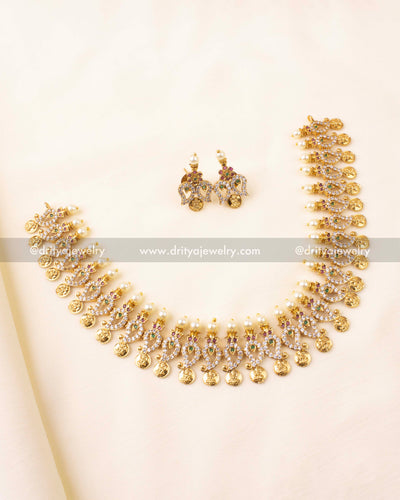 Temple-style short necklace set with coin motifs, peacock detailing, and matching earrings.