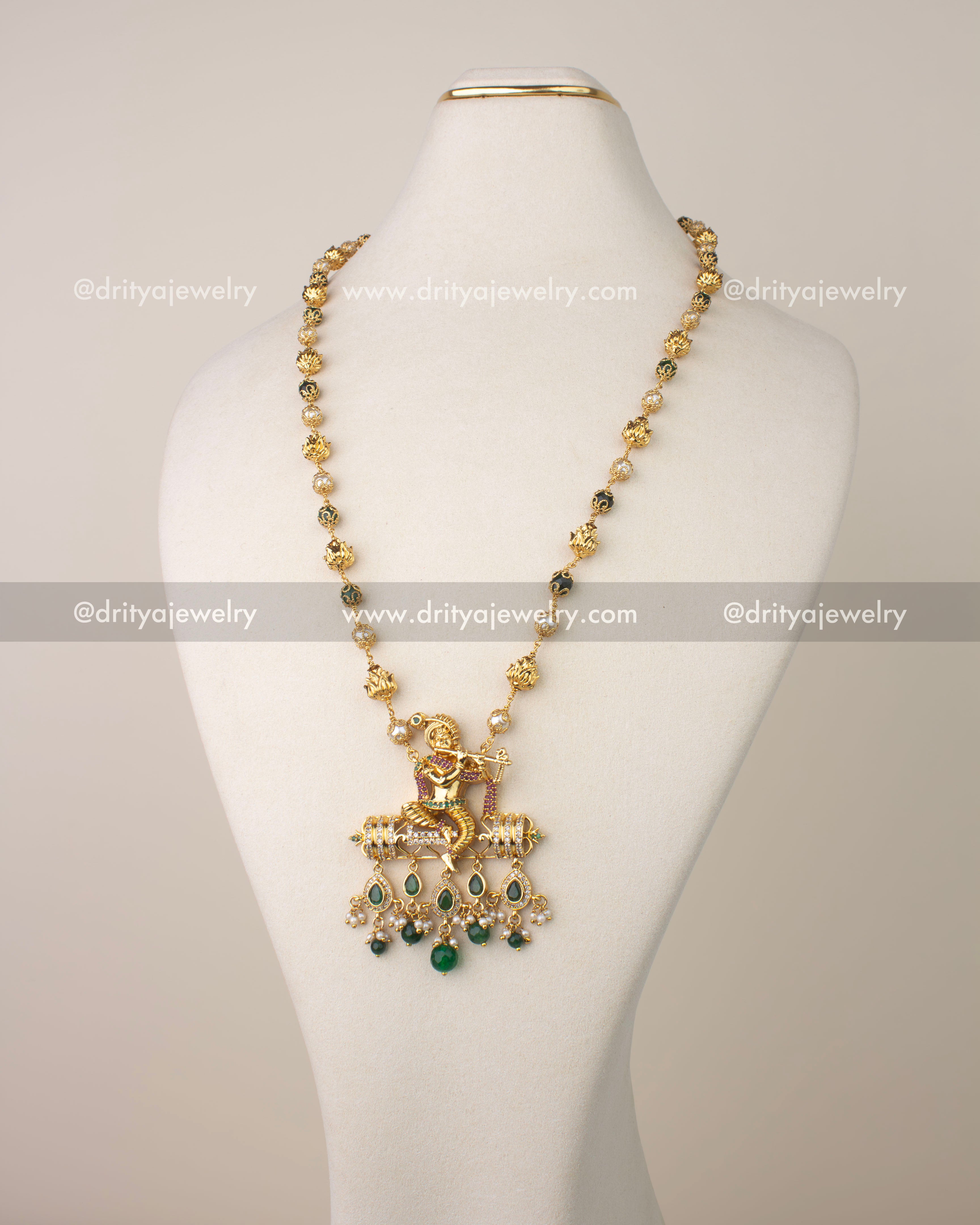 Premium temple jewelry necklace with Lord Krishna pendant and green bead drops.