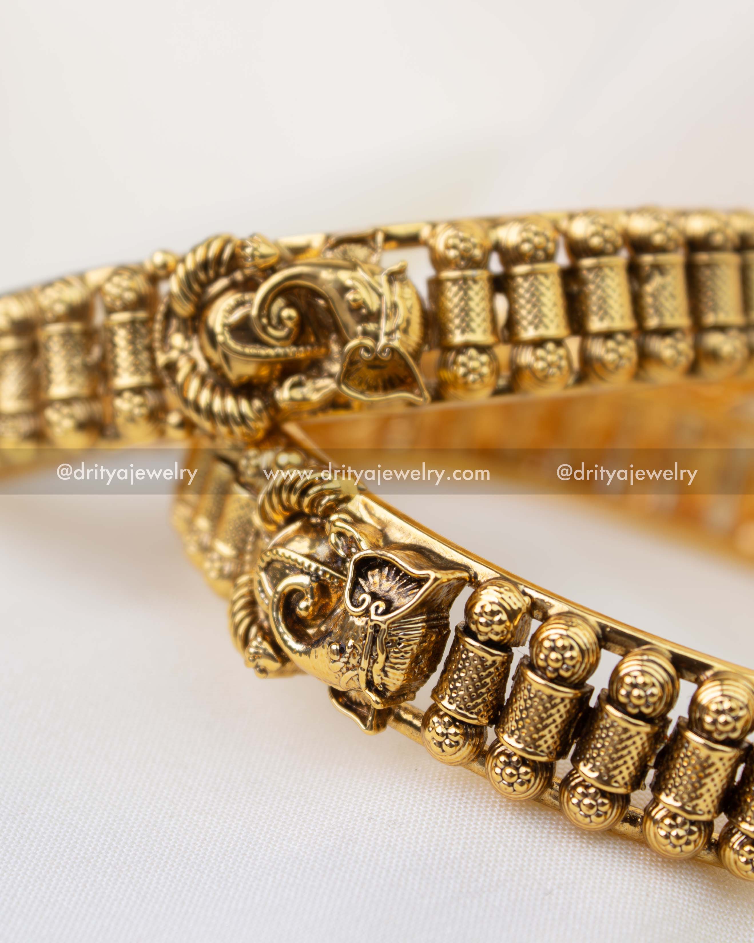 Premium antique temple bangles featuring intricate Lord Ganesha centerpiece design