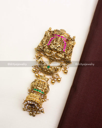 Green Kemp Jada Billa with antique finish, pearl hangings, and goddess motif.