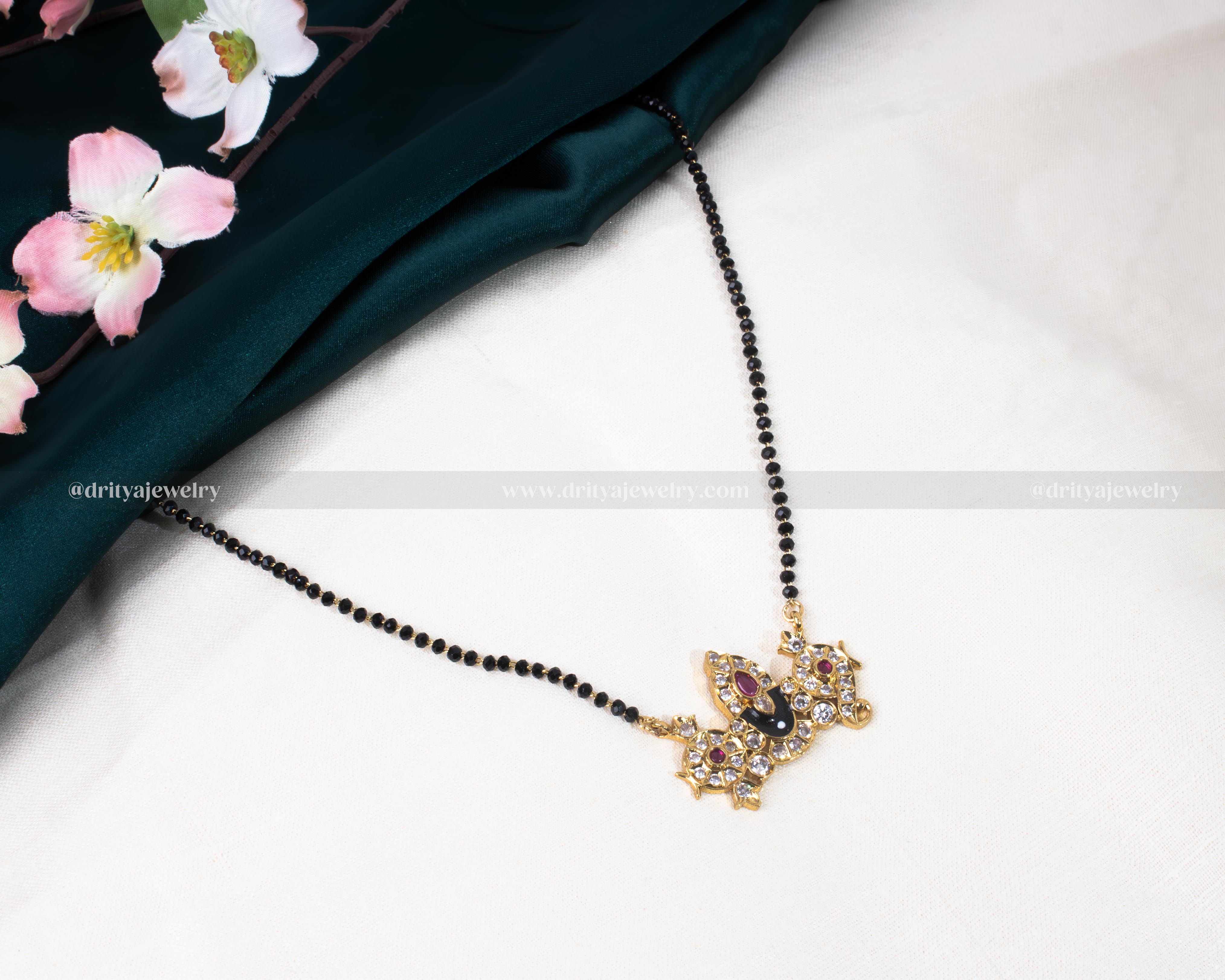 Full view of the Venkateswara Swamy black beads necklace featuring a multi-colored gemstone pendant by Dritya Jewelry.