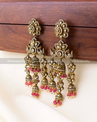 Elegant antique Victorian earrings featuring layered jhumkas and soft pink bead hangings.