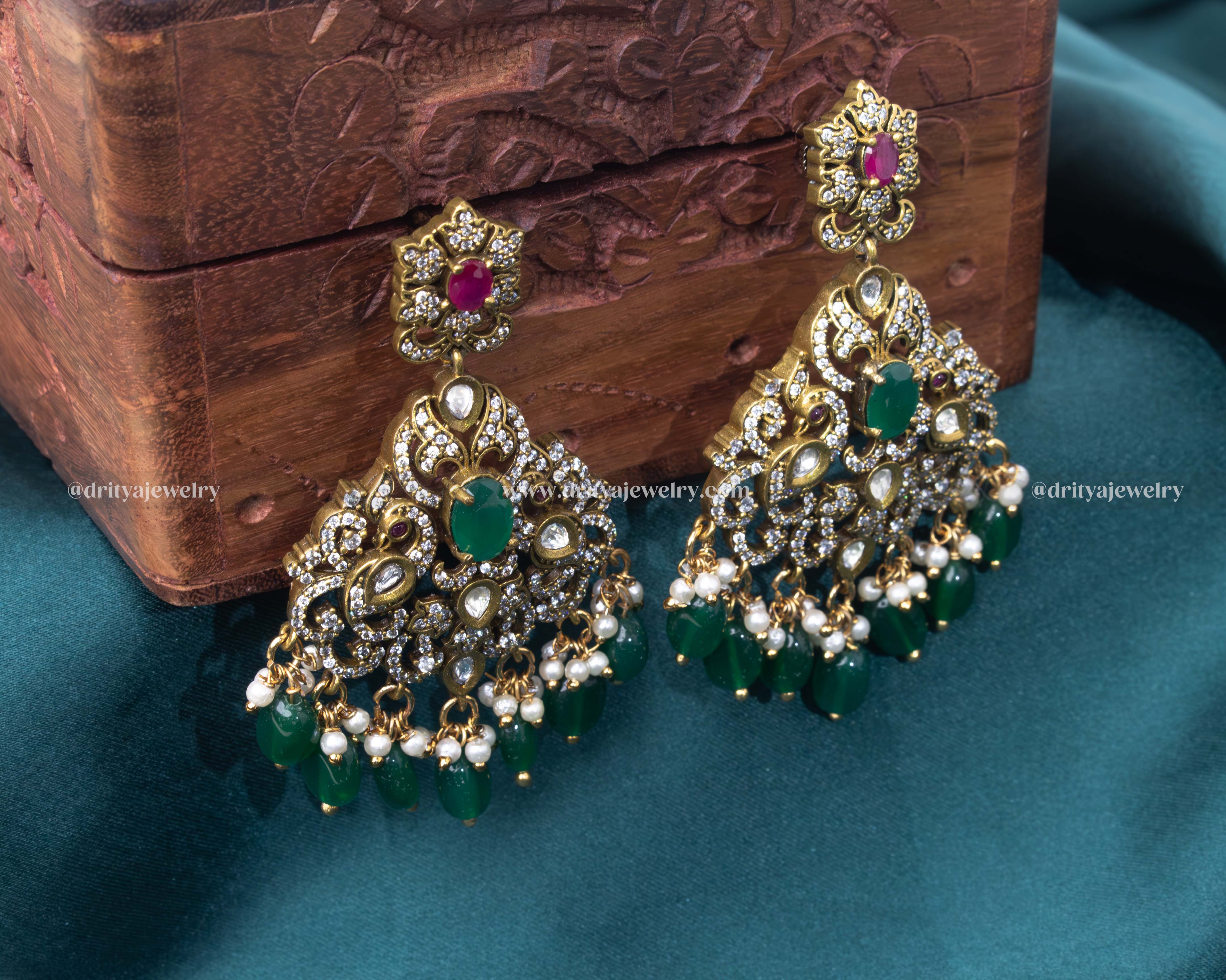 Exquisite gold-plated necklace set with multi-strand beads and an ornate green stone pendant, paired with matching earrings, perfect for weddings and special occasions.