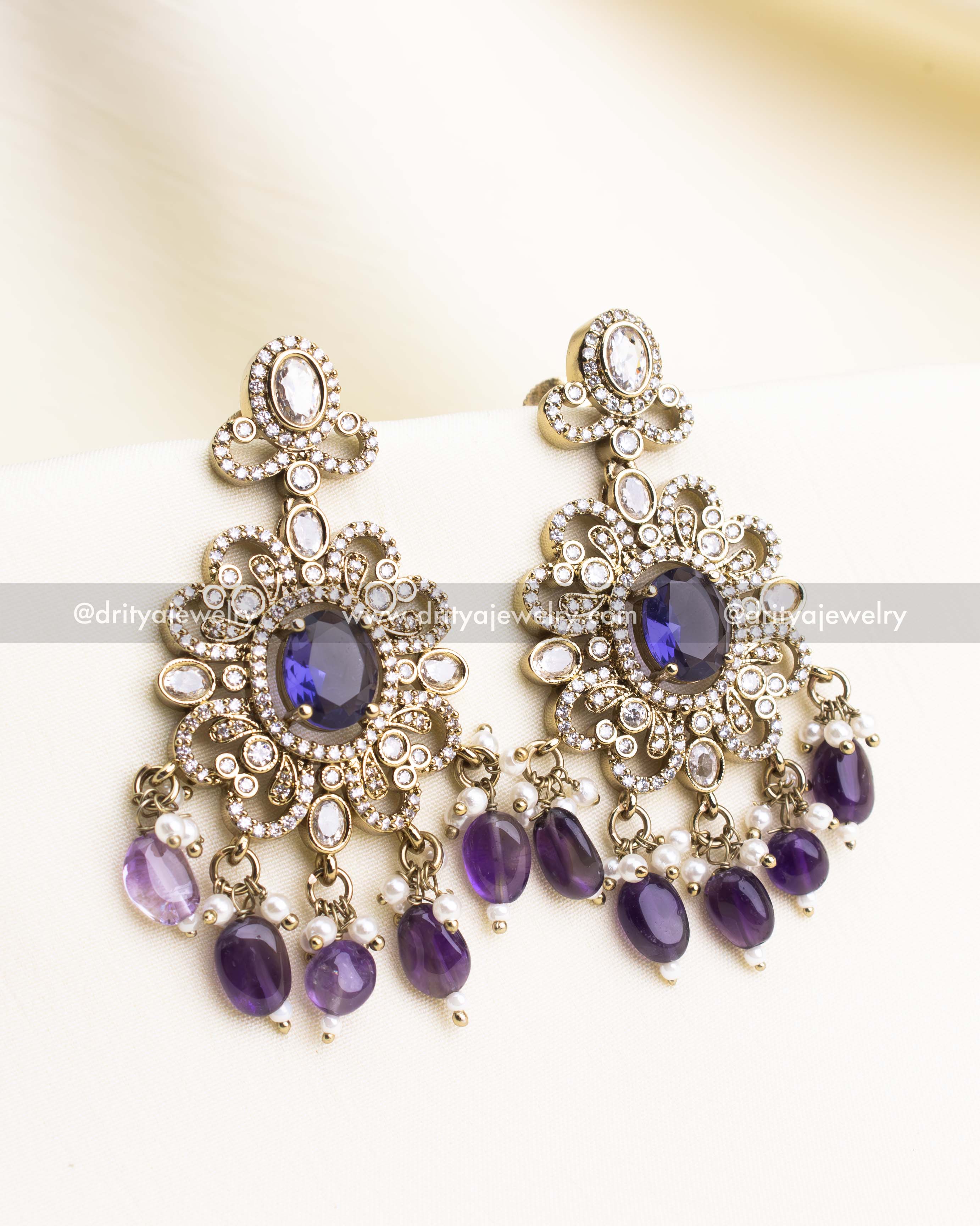 Antique-style Victorian earrings with CZ stones and purple bead drops.