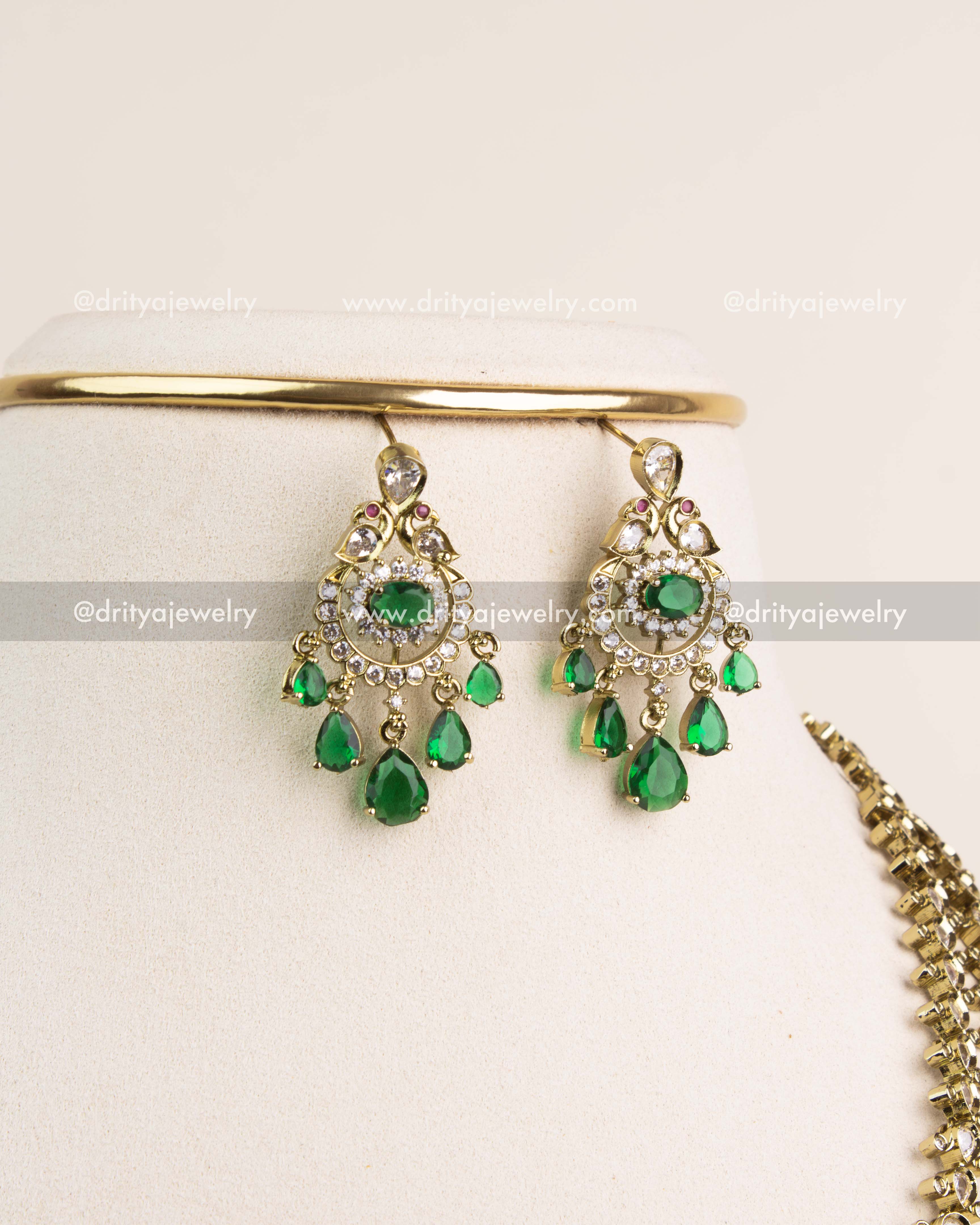 Matching Victorian earrings with CZ highlights and emerald green drop stones.