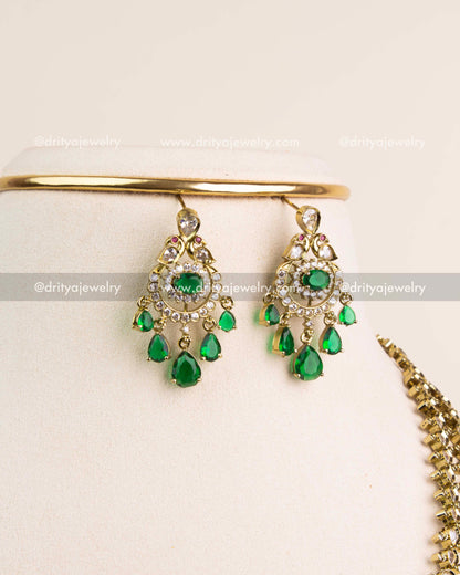 Matching Victorian earrings with CZ highlights and emerald green drop stones.