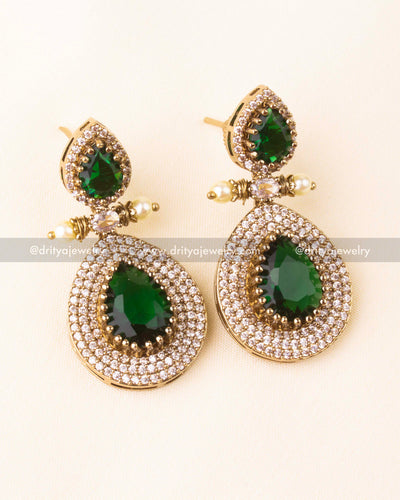 Premium Victorian layered short necklace with emerald-colored stones, zircon detailing, and pearl embellishments, paired with statement earrings.