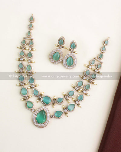 Full view of Victorian layered necklace set with mint green stones and matching earrings.
