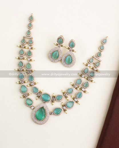 Full view of Victorian layered necklace set with mint green stones and matching earrings.
