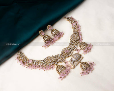 Premium Victorian necklace with an elephant centerpiece, adorned with CZ stones and blush pink accents.