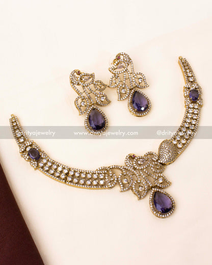 tunning Victorian-style necklace with a peacock motif and royal purple stones.