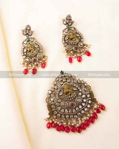 Temple-style Victorian pendant set featuring a gold-toned Goddess motif, CZ stones, pearls, and red beads