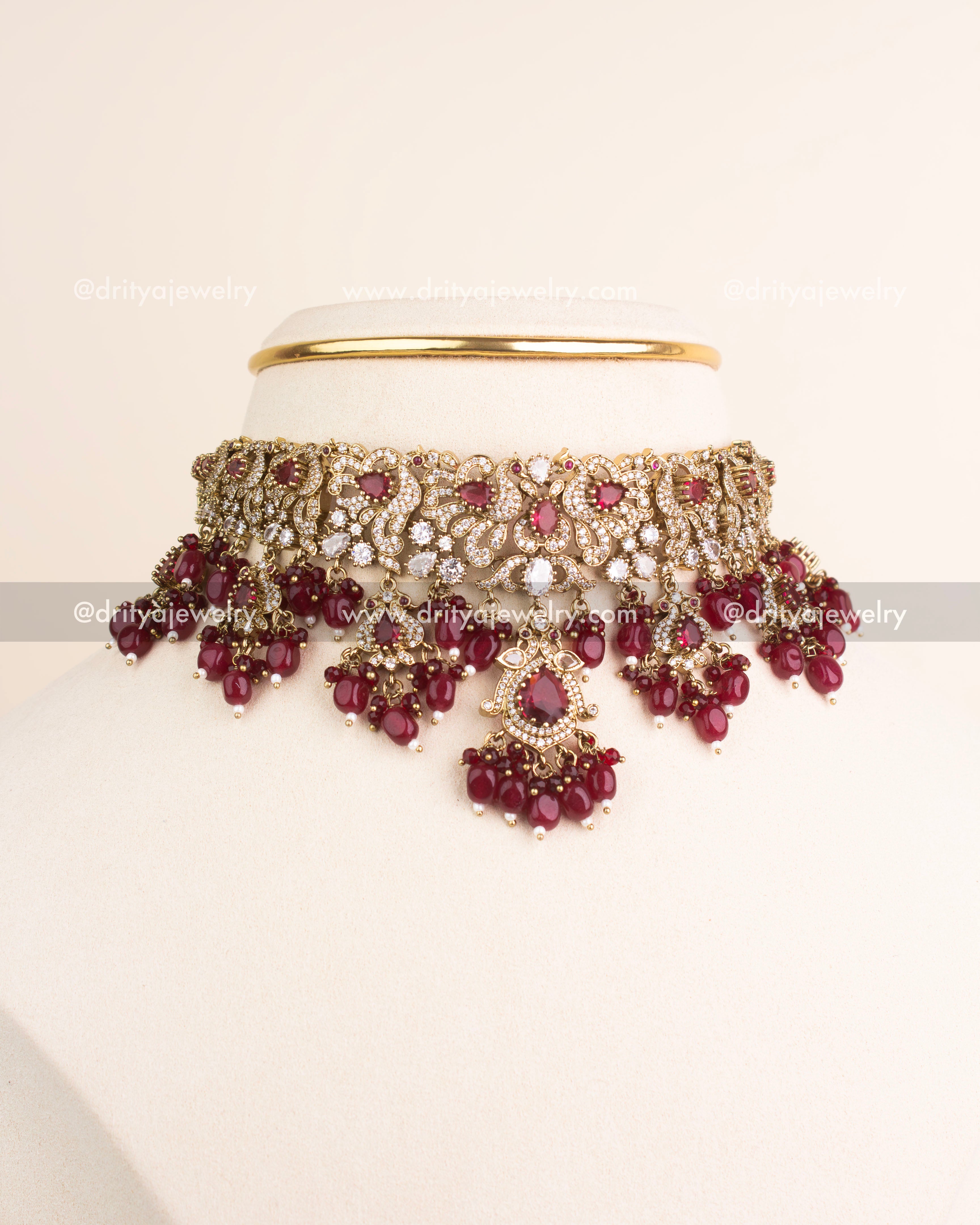 Ruby red Victorian choker necklace paired with matching earrings.
