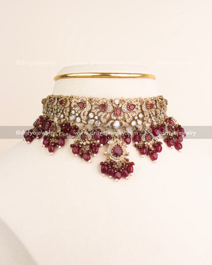 Ruby red Victorian choker necklace paired with matching earrings.