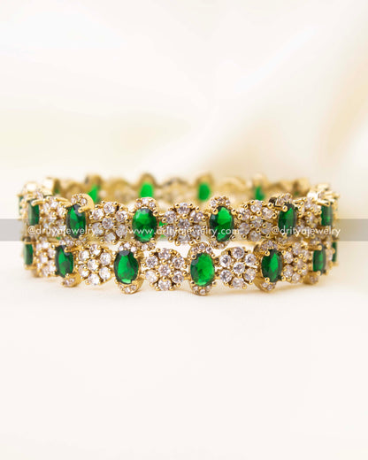 Side angle view of emerald green Victorian polish bangles showcasing detailed craftsmanship