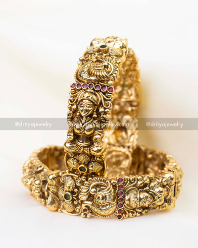 Antique gold bridal temple bangles with Lakshmi motif and Nakshi detailing