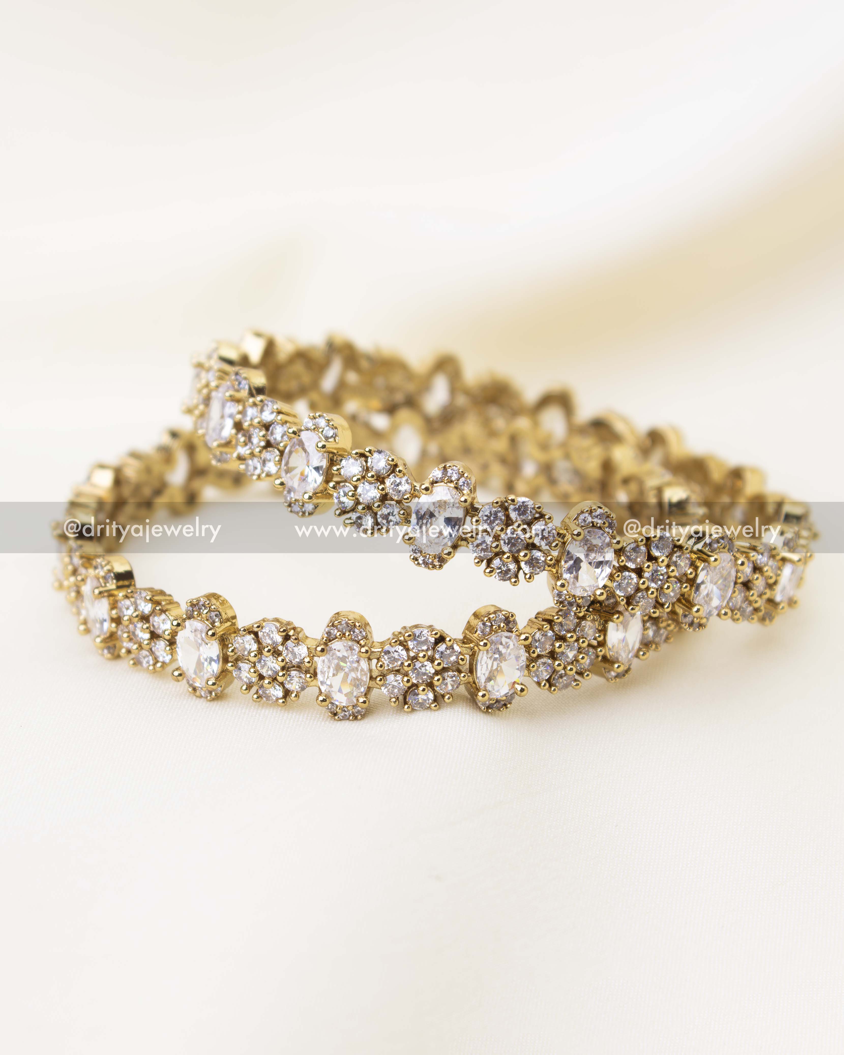 Close-up of diamond white CZ Victorian polish bangles with floral cluster stone setting