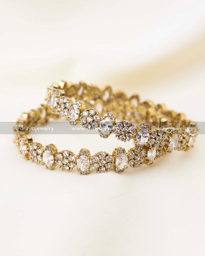 Close-up of diamond white CZ Victorian polish bangles with floral cluster stone setting