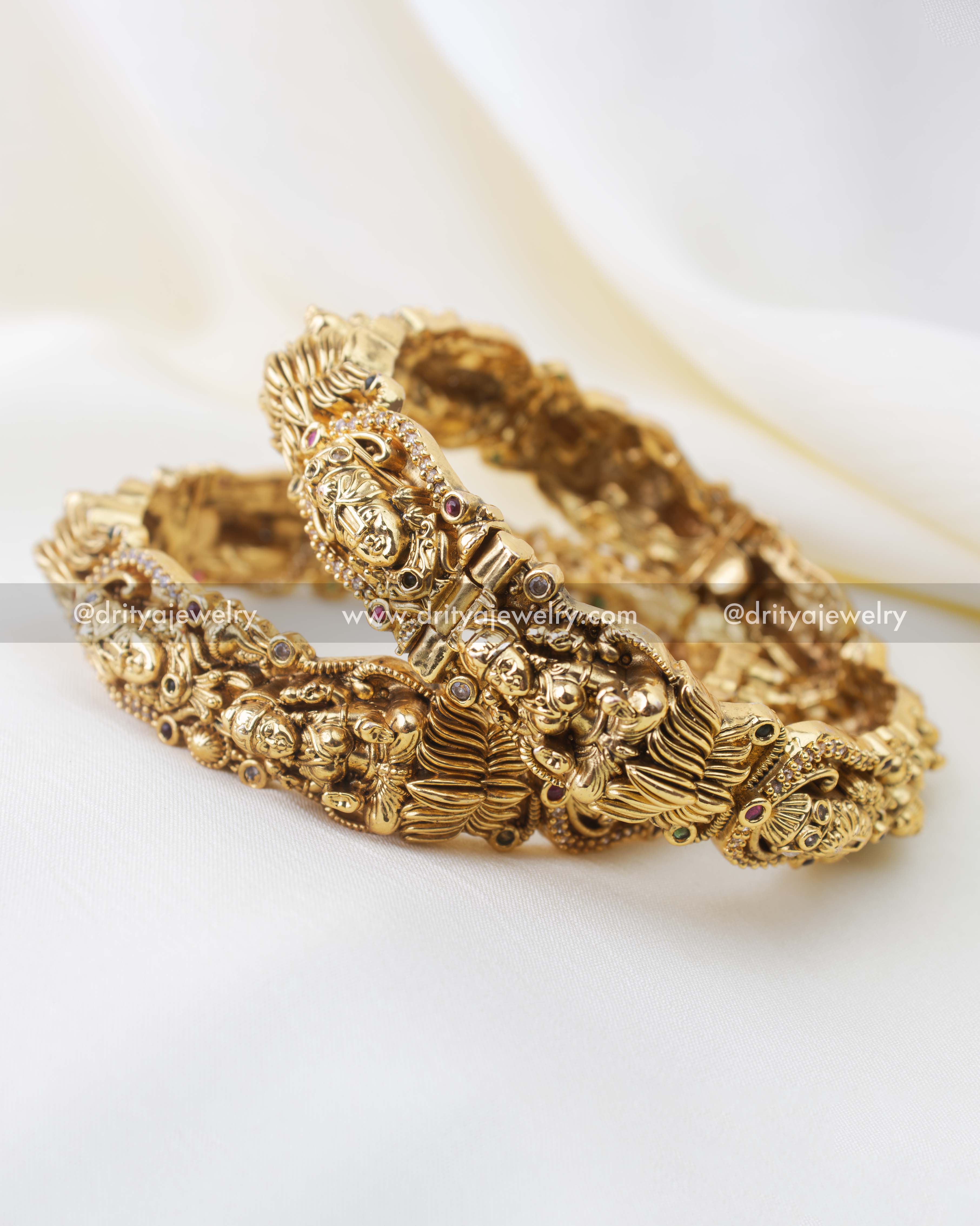 Close-up of temple nakshi bangle with goddess Lakshmi and Balaji sculpted motifs