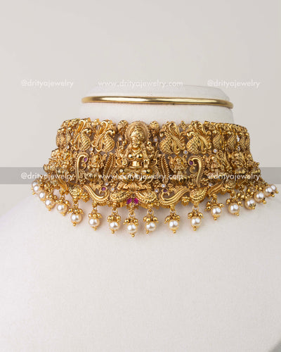 Nakshi temple choker set with Goddess Lakshmi motif and antique gold finish