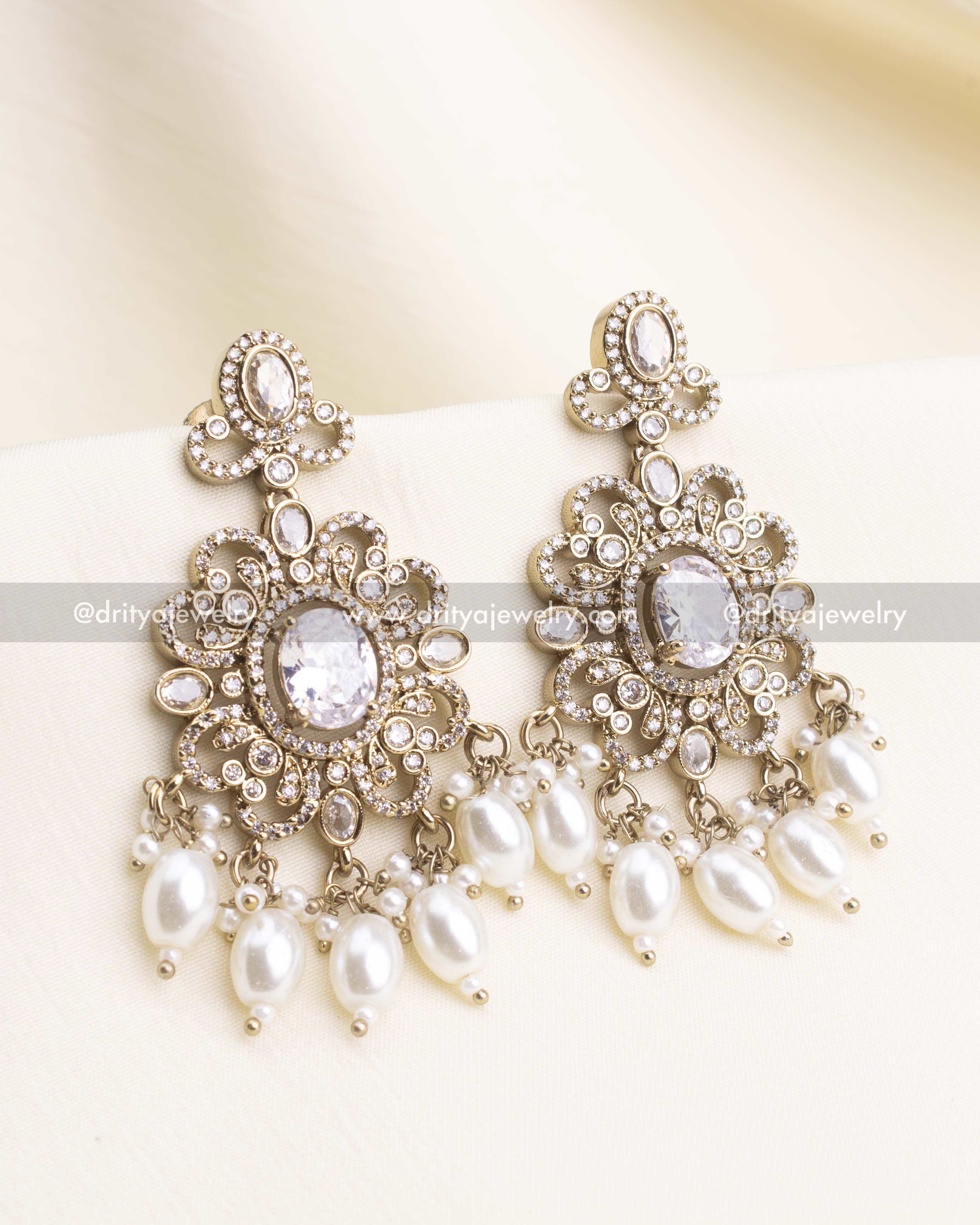 Antique-finish Victorian earrings featuring white CZ stones and pearl bead drops.