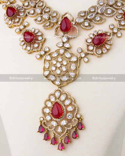 Cushion cut red stones framed with CZ in Victorian gold polish