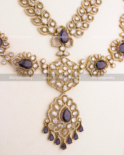 Center pendant of purple Victorian bridal necklace featuring teardrop stones, floral workmanship, and pearl-inspired drops.