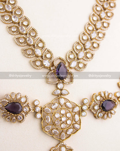 Center pendant of purple Victorian bridal necklace featuring teardrop stones, floral workmanship, and pearl-inspired drops.