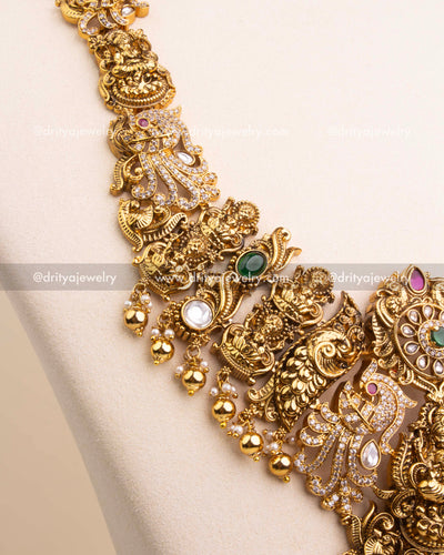 Detailed view of necklace chain with elephant, peacock, and Kundan designs