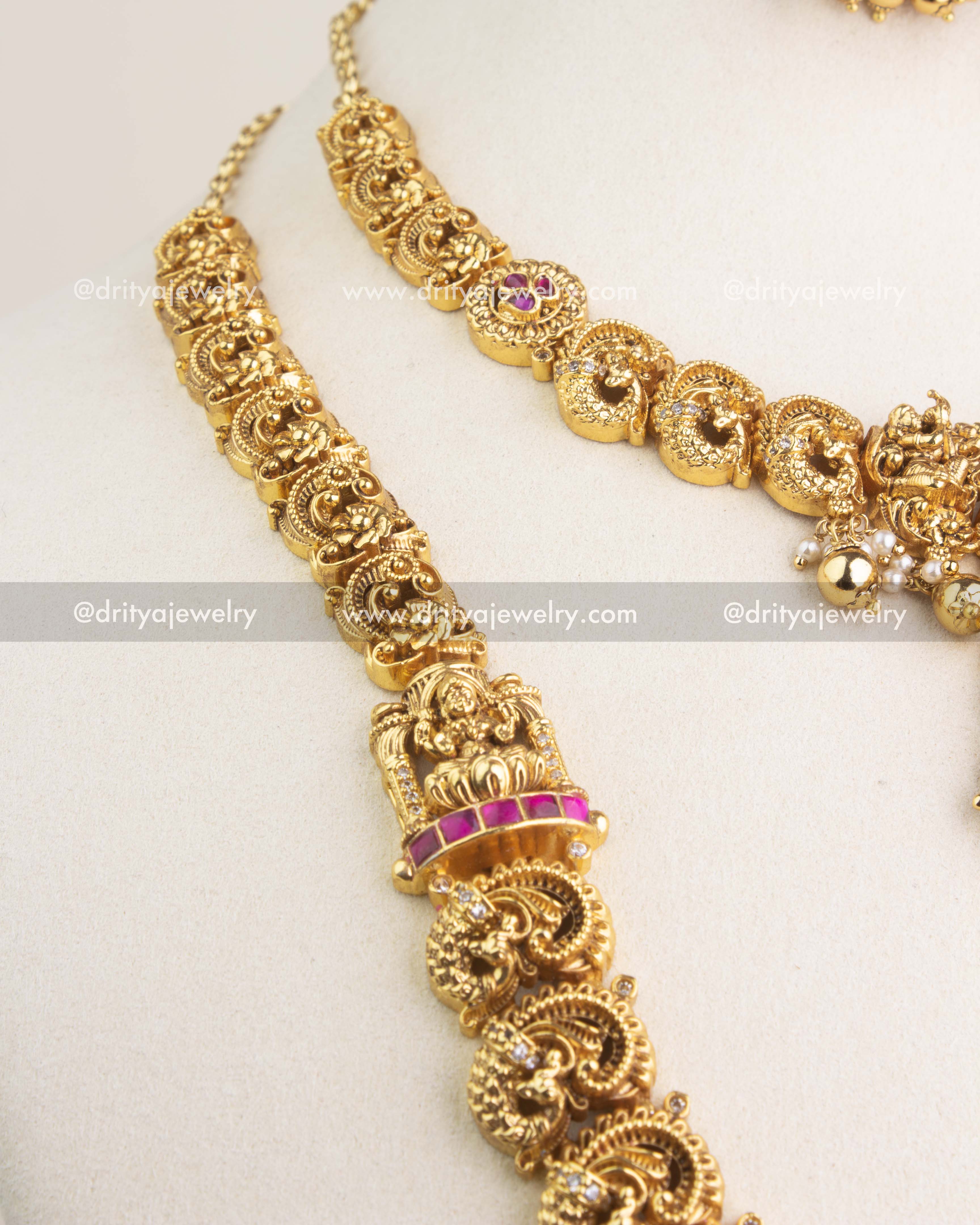 Temple jewelry combo set featuring long and short necklaces with Lakshmi motifs, kemp stones, and antique gold finish.