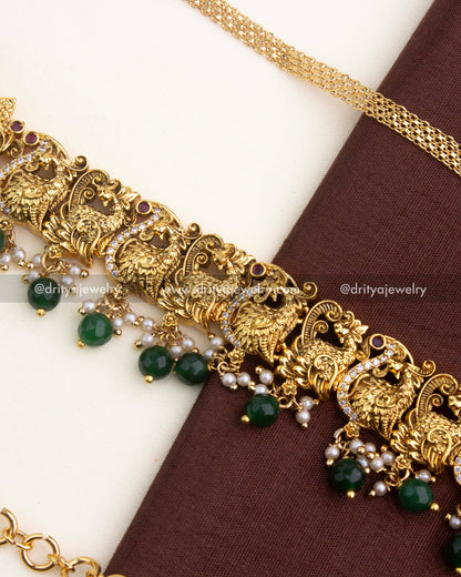 Adjustable temple hip chain with antique gold-plated layered chain detailing.