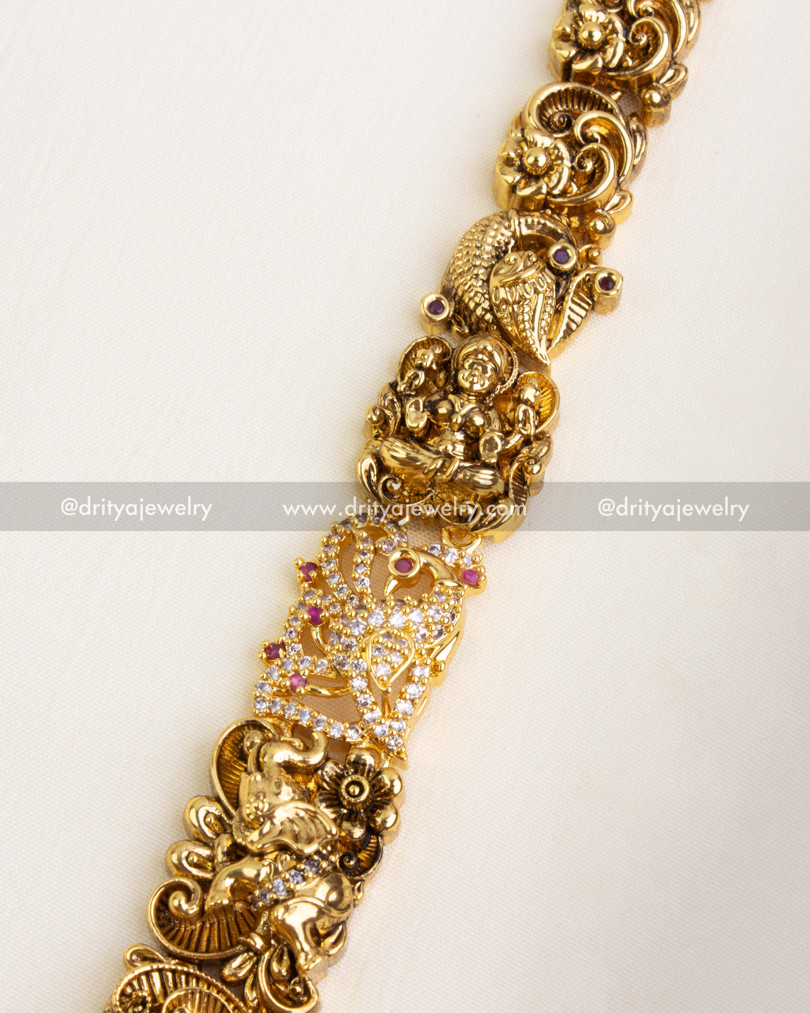 Close-up of the haram chain showcasing miniature elephant and peacock motifs with floral and stone embellishments.