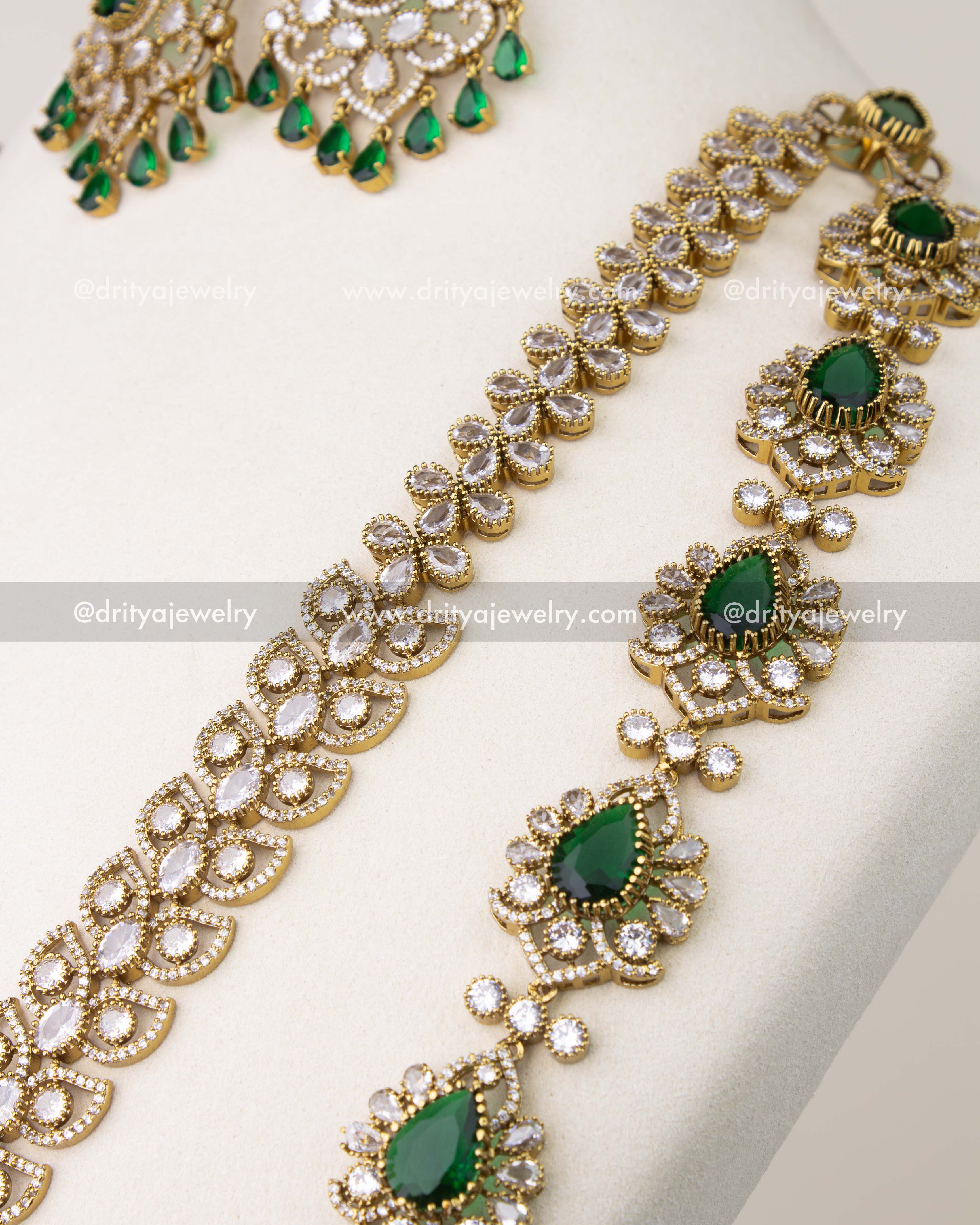 Close-up of emerald green stone pendant with crystal detailing in Victorian bridal necklace