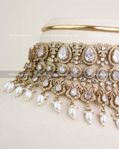 Close-up view of Russian emerald stones, teardrop motifs, and intricate Victorian filigree craftsmanship.