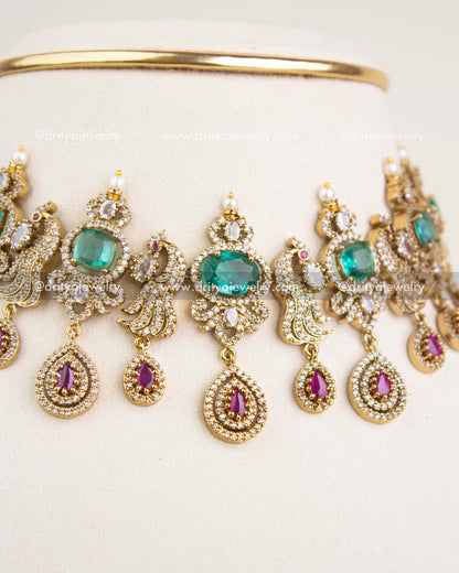 Close-up of Russian emerald stones, CZ clusters, pearl enhancements, and antique Victorian craftsmanship.