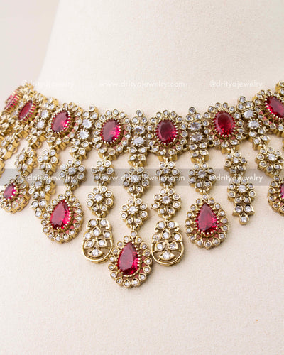 Close-up of ruby red stones with Victorian gold polish necklace