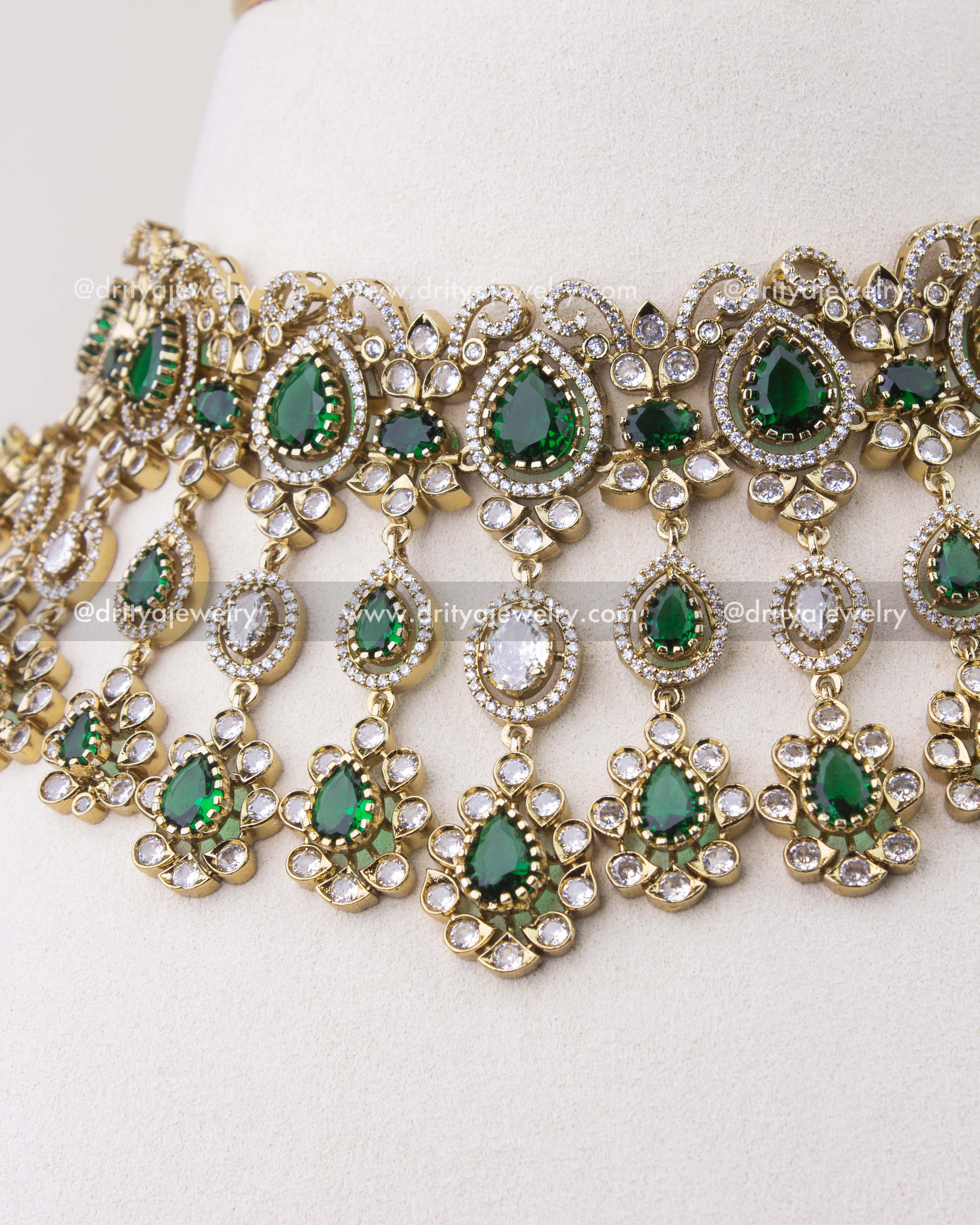 Close-up of emerald green Victorian choker with teardrop stones and dangling CZ elements