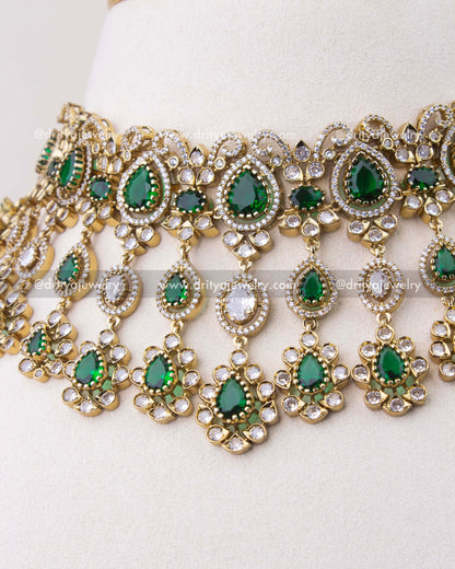 Close-up of emerald green Victorian choker with teardrop stones and dangling CZ elements