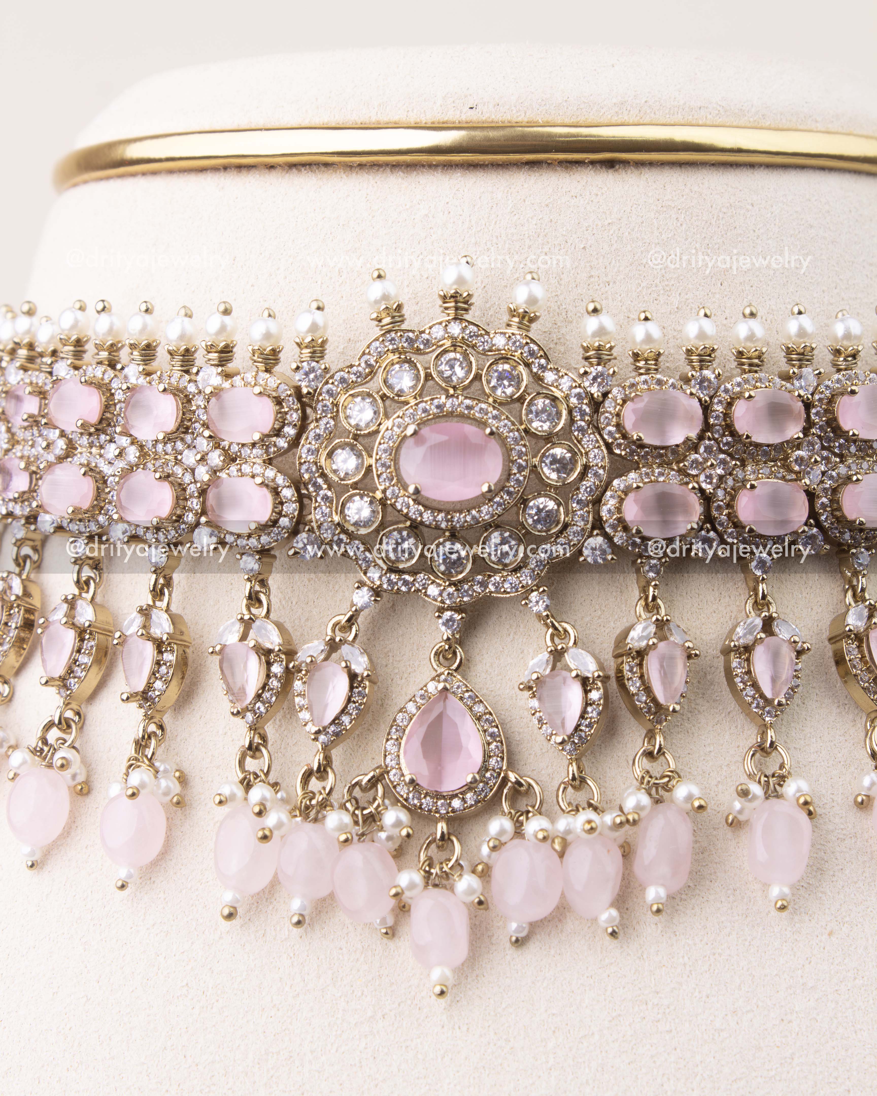 Close-up of blush pink stone Victorian choker featuring crystal detailing and pearl hangings