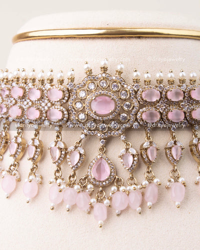 Close-up of blush pink stone Victorian choker featuring crystal detailing and pearl hangings